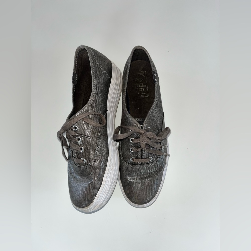Sparkly silver platform keds.